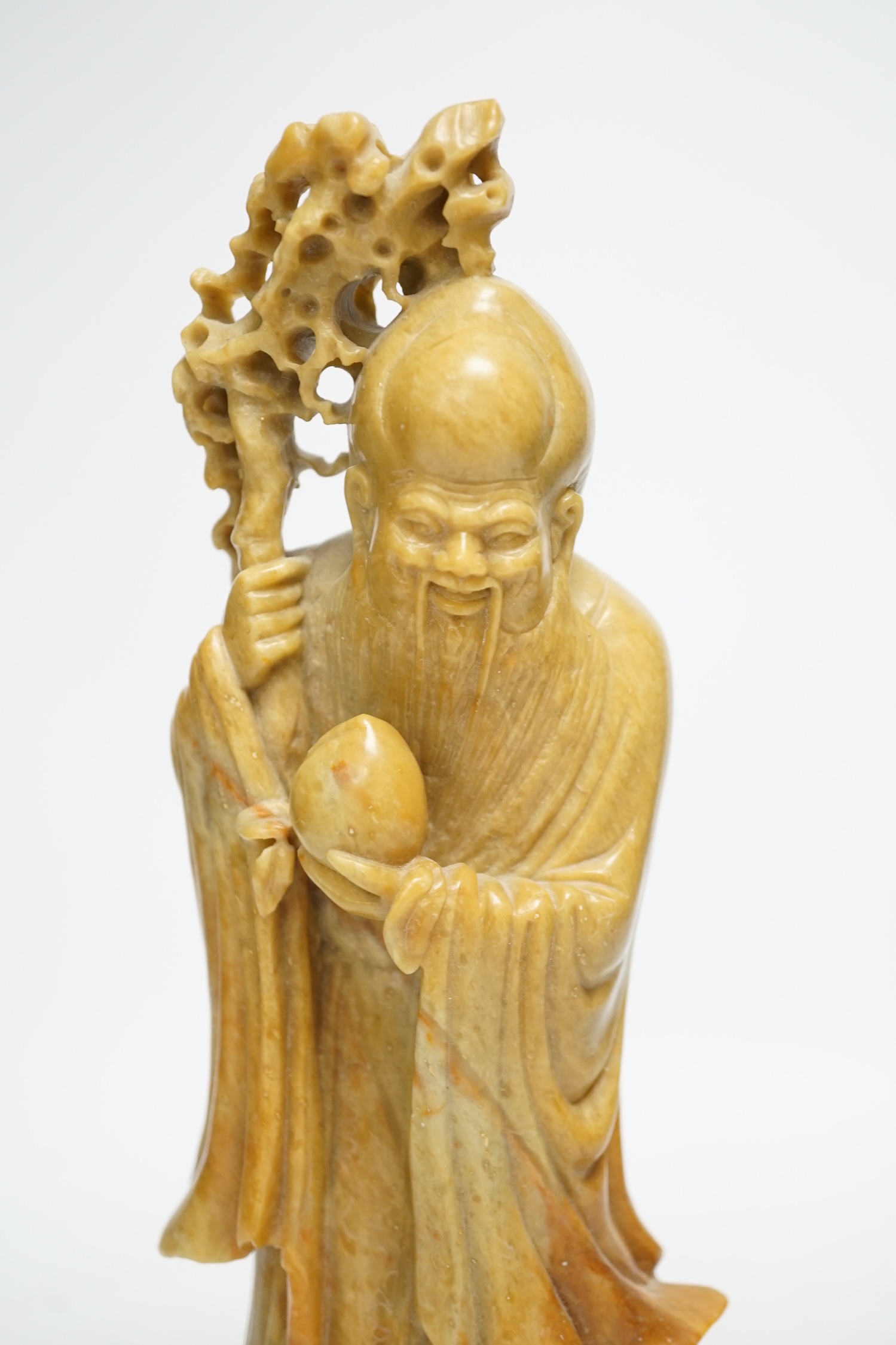 A Chinese soapstone standing figure of Shou Lao, 30cm. Condition - good.